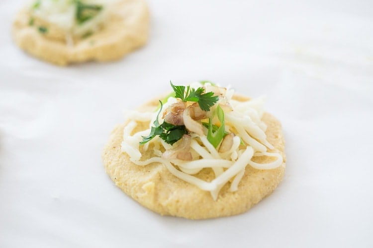 How to make Pupusas!  Delicious Salvadorian masa corn cakes filled with your choice of refried beans or cheese (or both!) with cilantro and scallions. A simple, easy recipe that is Vegan adaptable! #pupusa #pupusas #pupusarecipe #curtido #corncakes #masa #masacakes