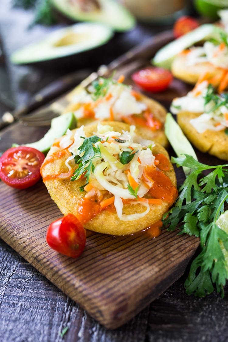 How to make Pupusas!  Delicious Salvadorian masa corn cakes filled with your choice of refried beans or cheese (or both!) with cilantro and scallions. A simple, easy recipe that is Vegan adaptable! #pupusa #pupusas #pupusarecipe #curtido #corncakes #masa #masacakes