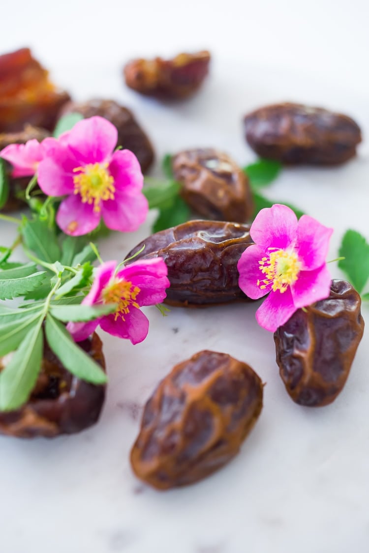 Stuffed Dates with Wild Rose Petals and Pistachios- a simple decadent appetizer or light dessert. #stuffeddates #dates #rosepetals #daterecipes #wildroses #rose #recipes 
