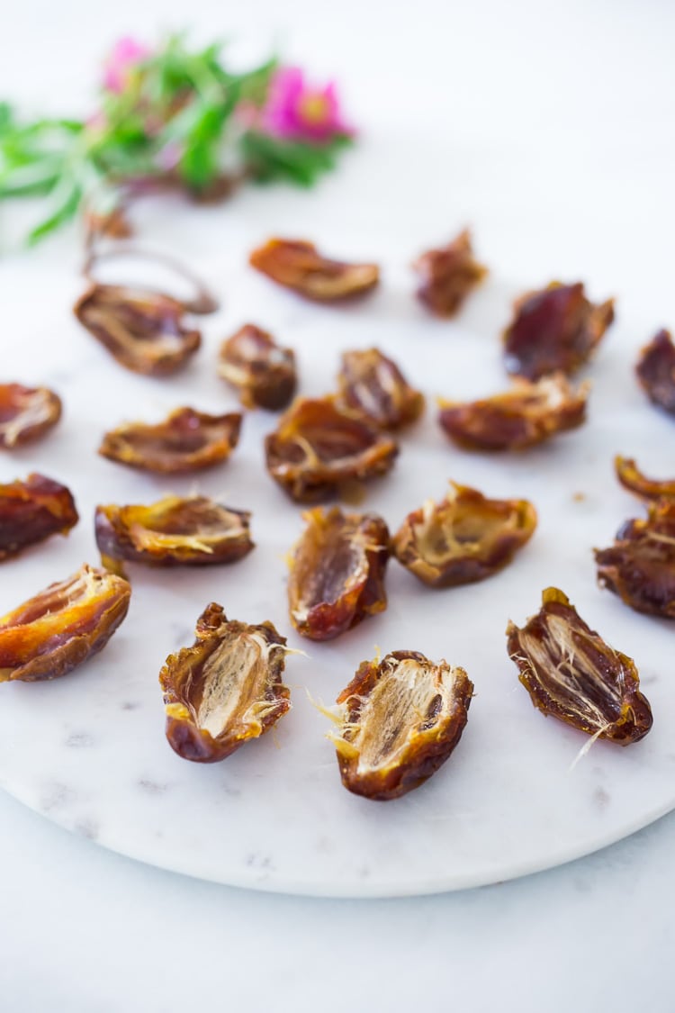 Stuffed Dates with Wild Rose Petals and Pistachios- a simple decadent appetizer or light dessert. #stuffeddates #dates #rosepetals #daterecipes #wildroses #rose #recipes 