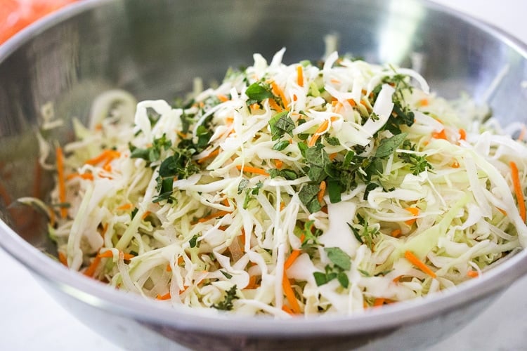 Curtido - A cultured Salvadorian Slaw with cabbage, carrots, onion and oregano. Simple to make, full of healthy probiotics! Use on Tacos, Pupusas, quesadillas or enchiladas as a delicious healthy condiment! #Curtido #fermented #slaw #cultured #kraut