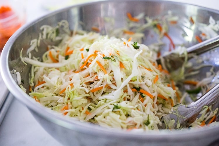 Curtido - A cultured Salvadorian Slaw with cabbage, carrots, onion and oregano. Simple to make, full of healthy probiotics! Use on Tacos, Pupusas, quesadillas or enchiladas as a delicious healthy condiment! #Curtido #fermented #slaw #cultured #kraut