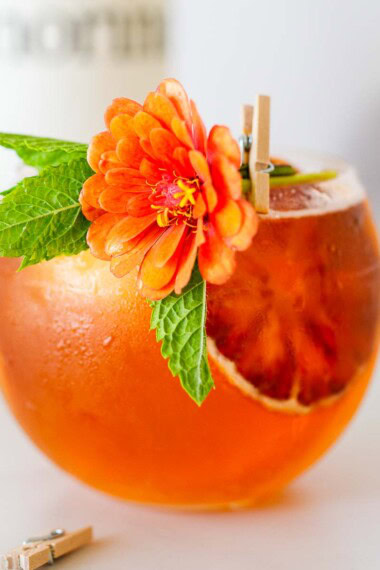 Elevated Aperol Spritz made with Amaro, in a glass with ice.