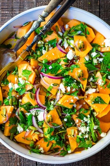 A refreshing Cantaloupe Salad with mint, lime, and pepitas with optional crumbled feta cheese- a tasty, healthy summer salad, perfect for potlucks and gatherings.