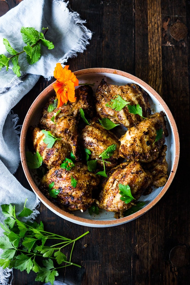 Grilled Moroccan Chicken with Ras El Hanout, garlic and lemon - a simple healthy recipe, using skinless chicken thighs, bursting with North African flavor! Delicious, fast and easy! #moroccanchicken #raselhanout #moroccanfood #moroccan