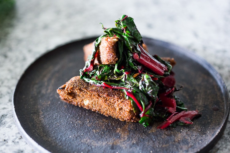 Crispy Teff Cakes with Wilted Chard and fresh Tomato Relish - a simple delicious vegan meal that is full of protein and nutrients! #teff #teffrecipes #teffcakes 
