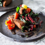 Crispy Teff Cakes with Wilted Chard and fresh Tomato Relish - a simple delicious vegan meal that is full of protein and nutrients! #teff #teffrecipes #teffcakes