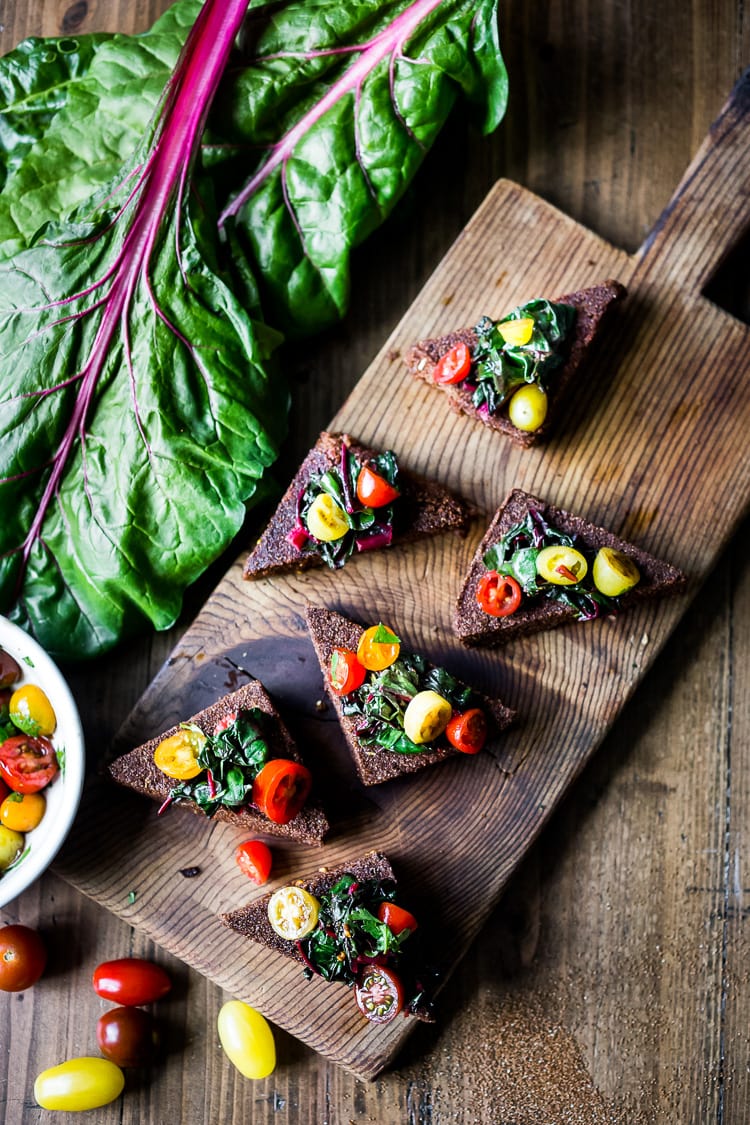 Crispy Teff Cakes with Wilted Chard and fresh Tomato Relish - a simple delicious vegan meal that is full of protein and nutrients! #teff #teffrecipes #teffcakes