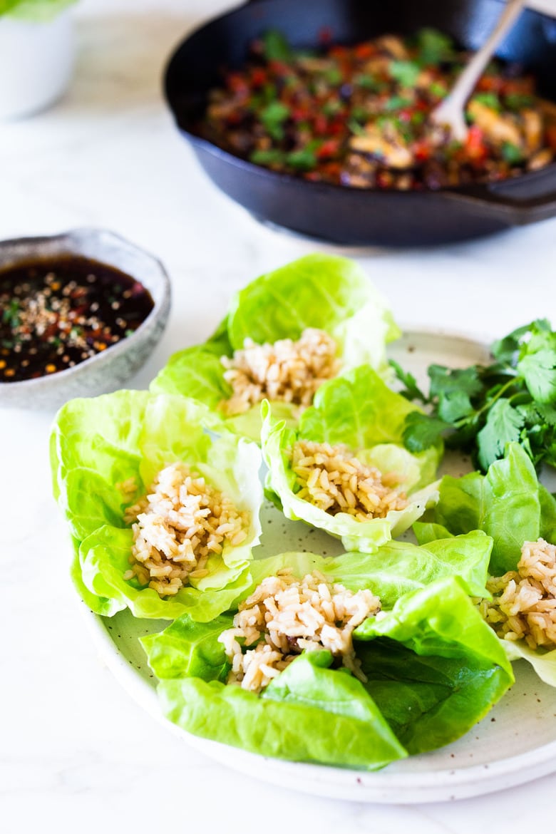 Delicious Vegan Lettuce Wraps are filled with Teriyaki Mushrooms and brown rice- an easy Asian-inspired lunch idea or appetizer that is healthy and satisfying.  #veganlunch #vegan #veganlettucewrap #shiitakewrap