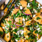 A refreshing Cantaloupe Salad with red onion, lime, cilantro, mint, Aleppo chili flakes, pepitas and optional crumbled feta (optional) - an easy healthy summer salad, perfect for potlucks and gatherings. Vegan adaptable! #cantaloupe #cantaloupesalad
