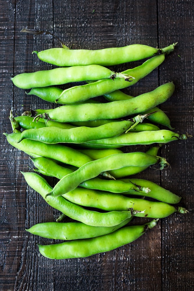 Grilled Fava Beans- with Mint, Lemon & Sumac, a simple, easy way to prepare fresh fava beans on the grill with Middle Eastern flavors. #fava #favabeans #grilled #favabeanrecipes 