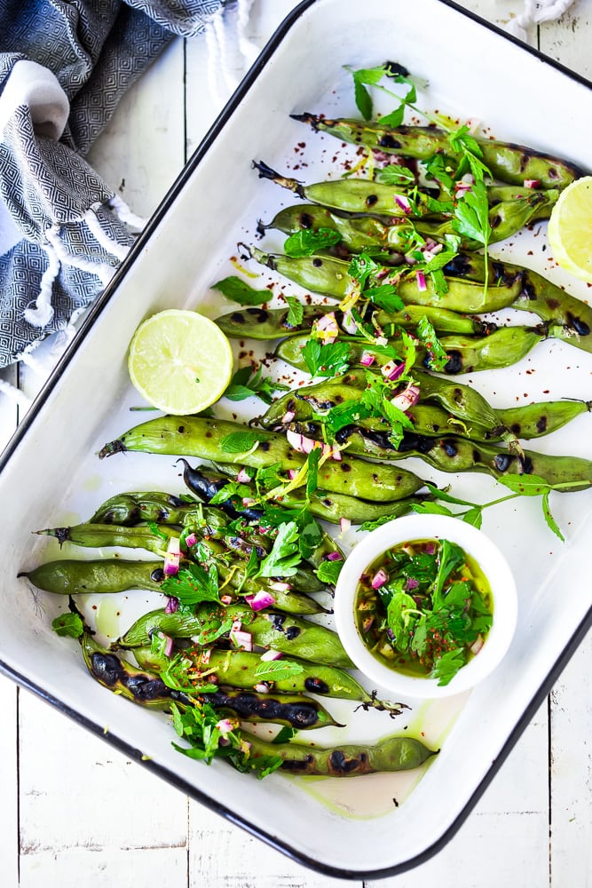 Grilled Fava Beans- with Mint, Lemon & Sumac, a simple, easy way to prepare fresh fava beans on the grill with Middle Eastern flavors. #fava #favabeans #grilled #favabeanrecipes 