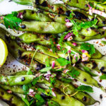Grilled Fava Beans- with Mint, Lemon & Sumac, a simple, easy way to prepare fresh fava beans on the grill with Middle Eastern flavors. #fava #favabeans #grilled #favabeanrecipes