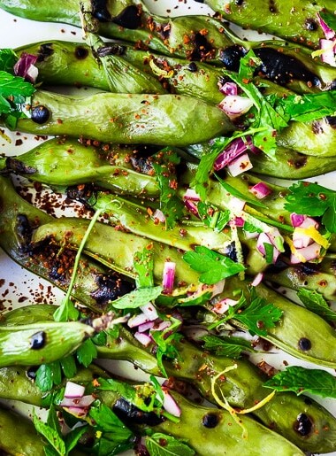 Grilled Fava Beans- with Mint, Lemon & Sumac, a simple, easy way to prepare fresh fava beans on the grill with Middle Eastern flavors. #fava #favabeans #grilled #favabeanrecipes