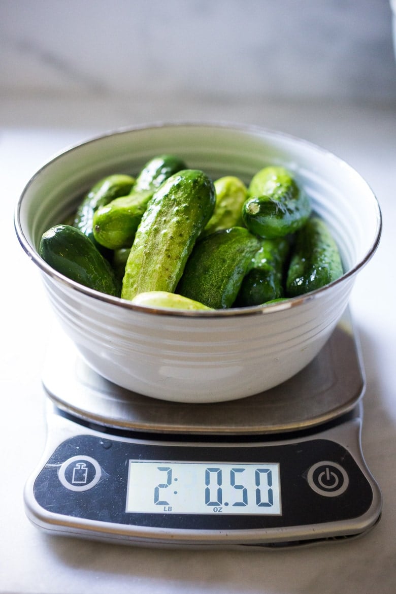 weighing the cucumbers. 