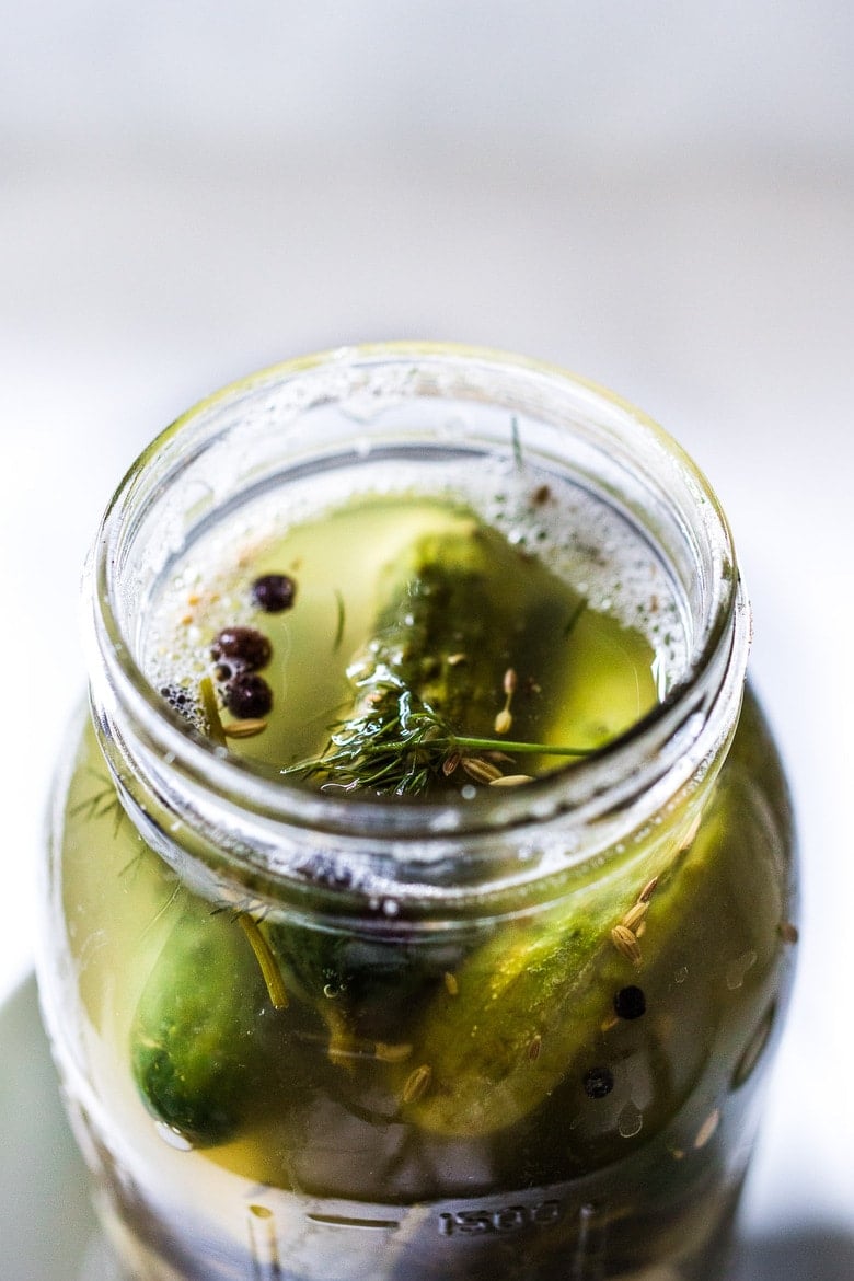 How to make Manhattan-style, Fermented "Kosher" Dill Pickles! A simple recipe for making the most flavorful, crunchy, tangy, garlic dill pickles with only 15 minutes of hands-on time. Simple easy instructions! #pickles #dillpickles #fermented #fermentedpickles #cultured #preserving #pickledcucumbers