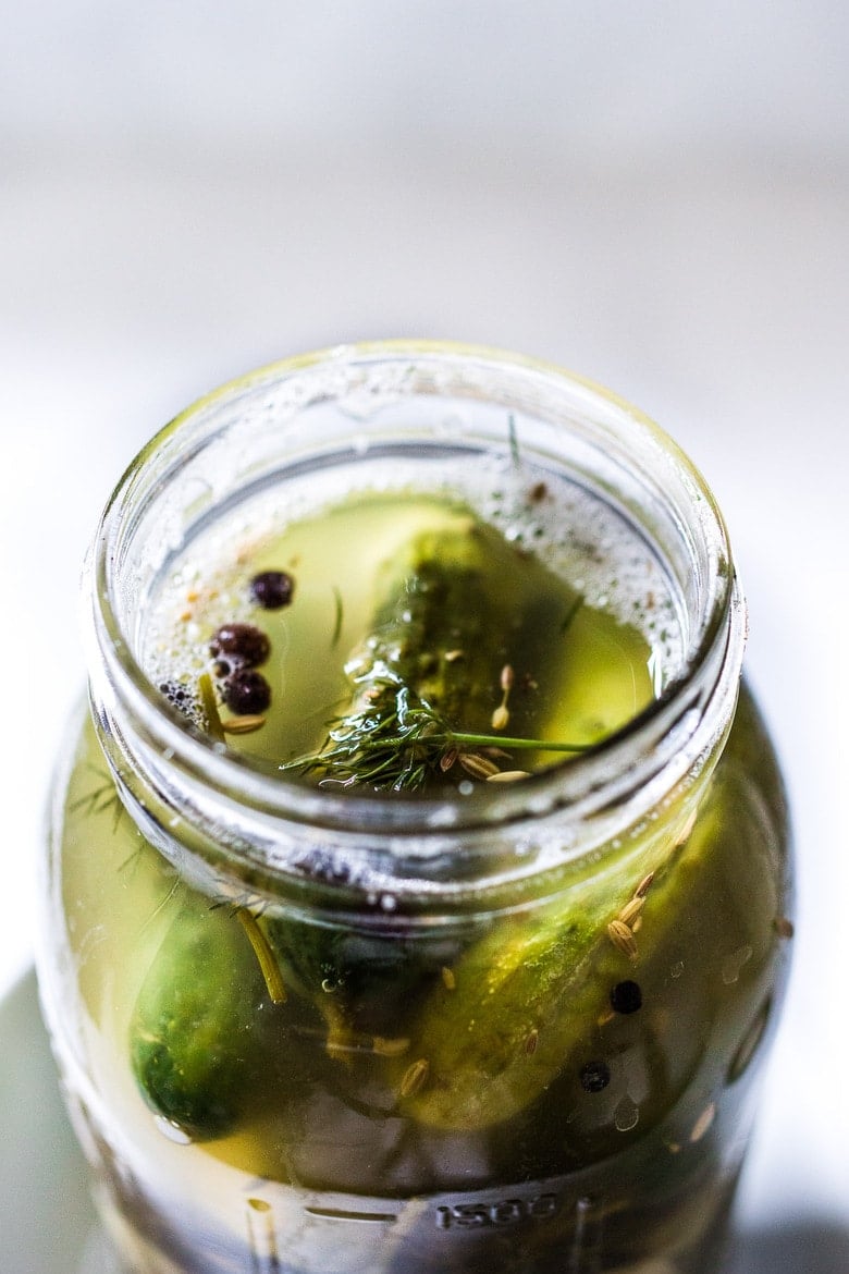 Fermented cucumber pickles in a jar.