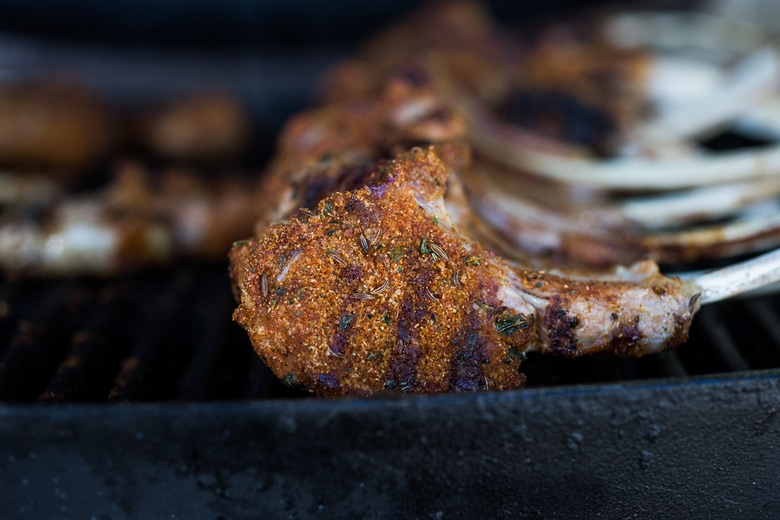 Harissa Grilled Lamb Chops with Harissa Yogurt and summer veggies- a simple easy meal, perfect for entertaining! #lamb #lambchops #grilledlamb #grilledlambchops