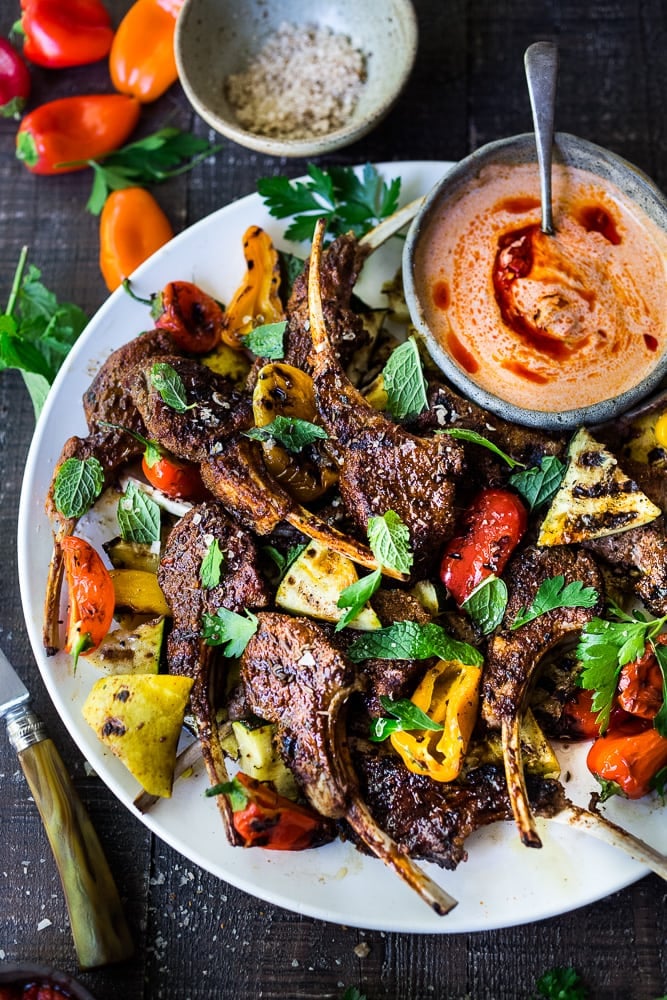 Harissa Grilled Lamb Chops with Harissa Yogurt and summer veggies- a simple easy meal, perfect for entertaining! #lamb #lambchops #grilledlamb #grilledlambchops