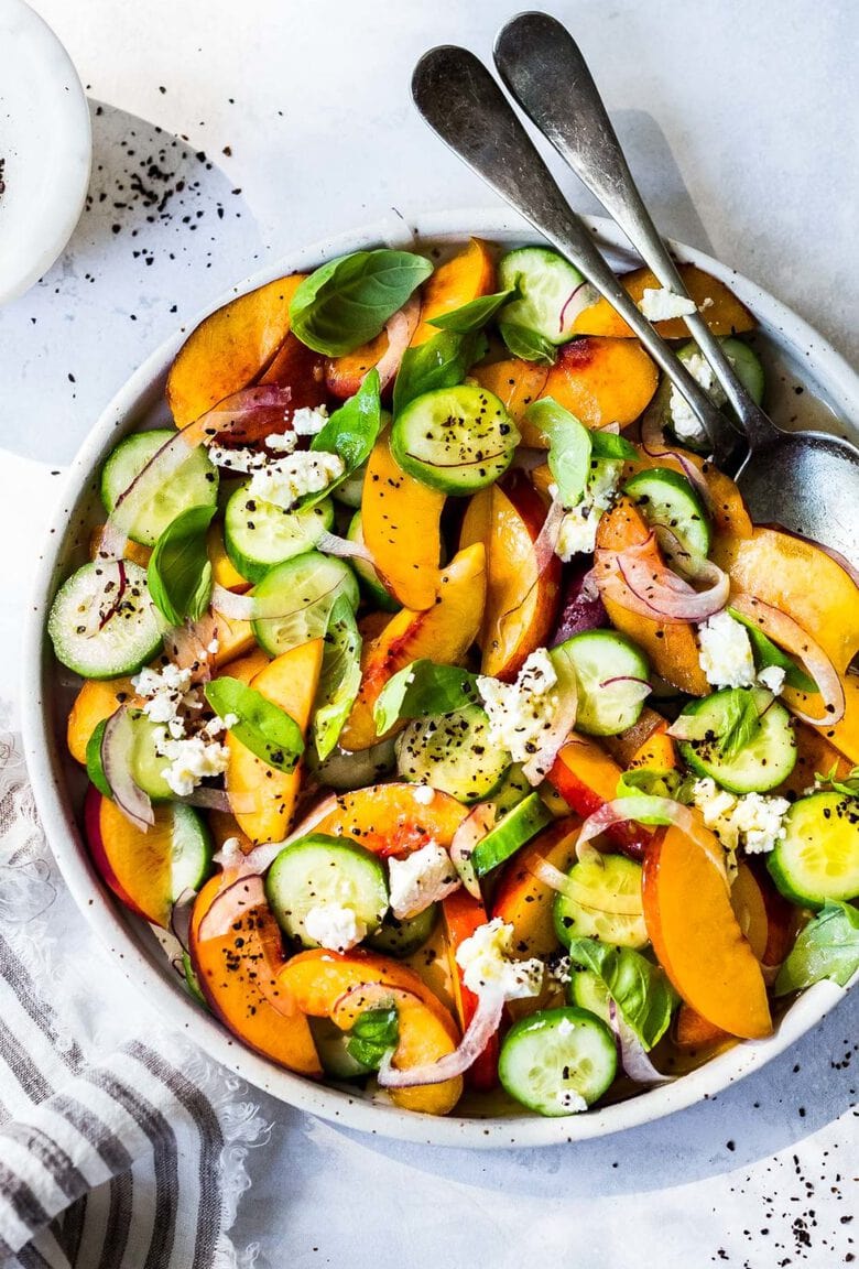 Nectarine Salad with cucumber, Basil, Goats Cheese, Red onion and optional Urfa Biber ( Turkish Chili Pepper). A simple delicious Farmers Market Salad you can put together in minutes! #nectarinesalad #nectarines #nectarinerecipes #farmersmarket #healthysalad #easysalads #cucumbersalad