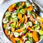 Nectarine Salad with cucumber, Basil, Goats Cheese, Red onion and optional Urfa Biber ( Turkish Chili Pepper). A simple delicious Farmers Market Salad you can put together in minutes! #nectarinesalad #nectarines #nectarinerecipes #farmersmarket #healthysalad #easysalads #cucumbersalad