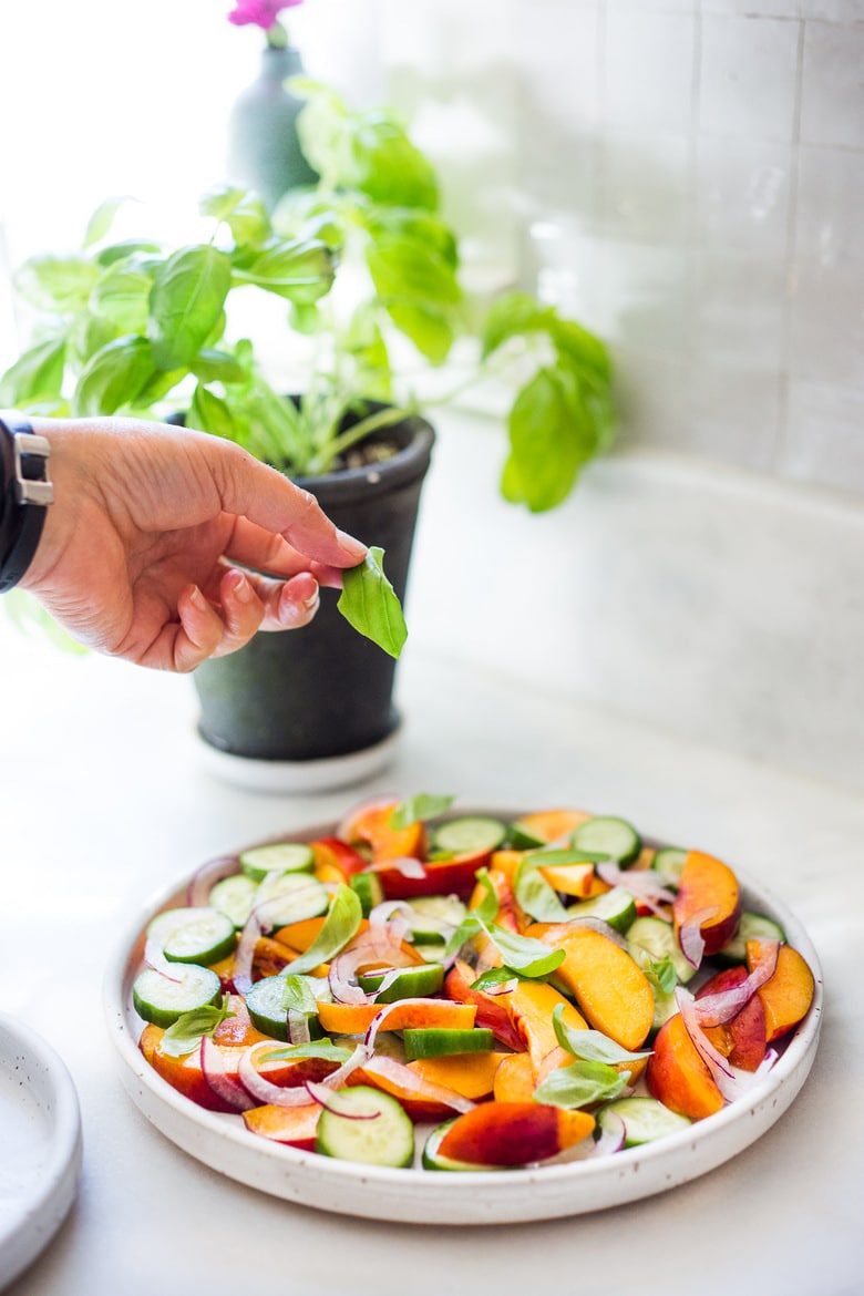 Nectarine Salad with cucumber, Basil, Goats Cheese, Red onion and optional Urfa Biber ( Turkish Chili Pepper). A simple delicious Farmers Market Salad you can put together in minutes! #nectarinesalad #nectarines #nectarinerecipes #farmersmarket #healthysalad #easysalads #cucumbersalad