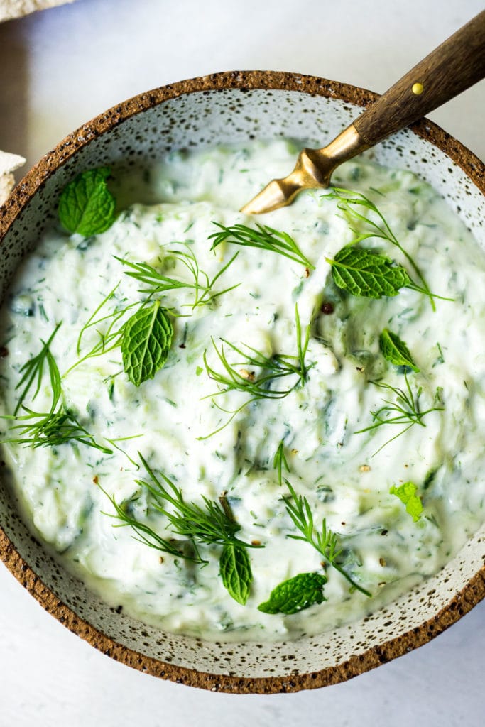 EPIC Tzatziki Sauce! - How to make the BEST tzatziki sauce - a healthy, delicious Greek cucumber-yogurt sauce to use in mezze platters, wraps, gyros, or as a simple dip for pita, or as a delicious side to Mediterranean dishes. This EASY authentic recipe can be made in 15 minutes! #tzatziki #tzatzikirecipe #tzatzikisauce #easy #cucumbersalad