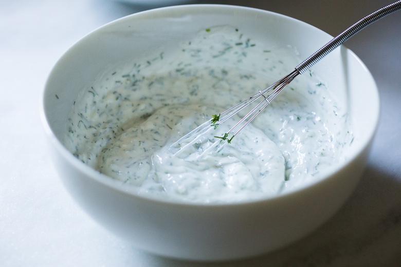 Tzatziki Sauce - a healthy, flavorful Greek cucumber-yogurt sauce to use in wraps and gyros, or as a dip for pita, or as a delicious side to Mediterranean dishes. This simple EASY recipe can be made in 15 minutes! #tzatziki #tzatzikirecipe #tzatzikisauce #easy #cucumbersalad 