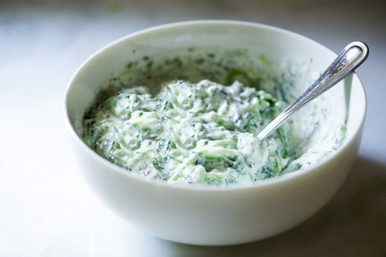 Tzatziki Sauce - a healthy, flavorful Greek cucumber-yogurt sauce to use in wraps and gyros, or as a dip for pita, or as a delicious side to Mediterranean dishes. This simple EASY recipe can be made in 15 minutes! #tzatziki #tzatzikirecipe #tzatzikisauce #easy #cucumbersalad 
