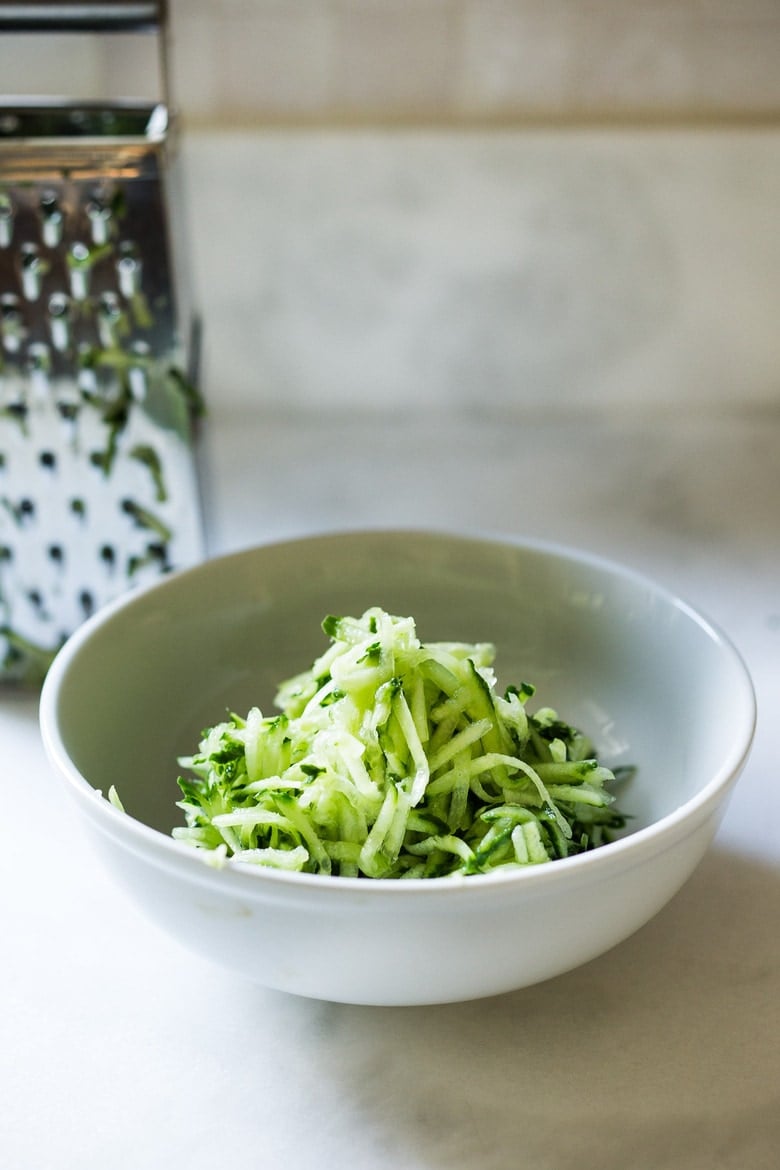 Tzatziki Sauce - a healthy, flavorful Greek cucumber-yogurt sauce to use in wraps and gyros, or as a dip for pita, or as a delicious side to Mediterranean dishes. This simple EASY recipe can be made in 15 minutes! #tzatziki #tzatzikirecipe #tzatzikisauce #easy #cucumbersalad 