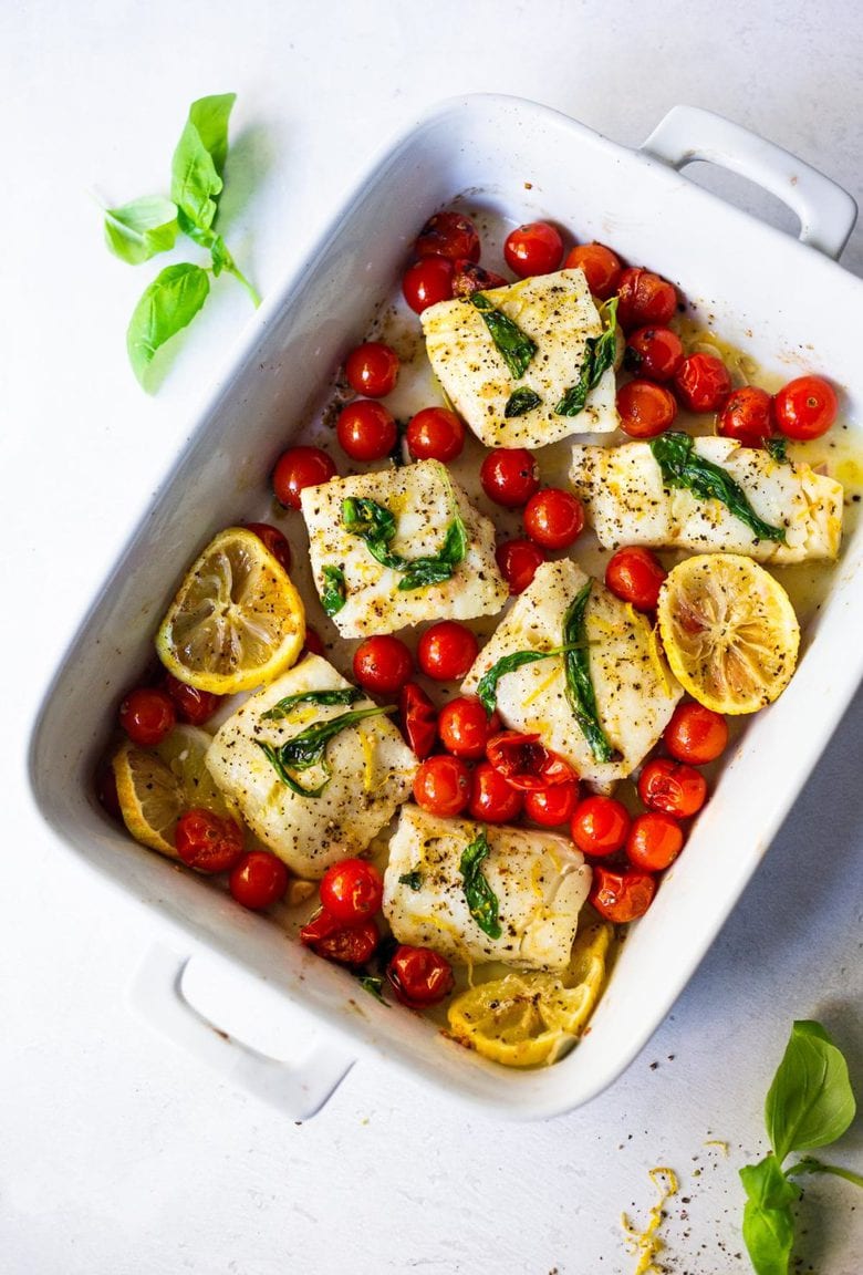 Simple Baked Cod with Tomatoes, Basil, Garlic Lemon- a fast and easy weeknight dinner that is healthy and delicious! #bakedcod #bakedfish #keto #keporecipes #weeknightdinner #weeknightdinners #easyfishrecipes