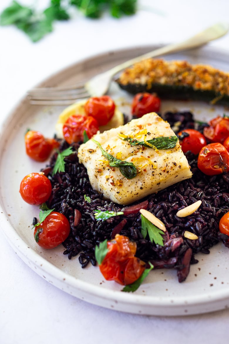 Simple Baked Cod with Tomatoes, Basil, Garlic and Lemon- a fast and easy weeknight dinner that is healthy and delicious! #bakedcod #bakedfish #keto #keporecipes #weeknightdinner #weeknightdinners #easyfishrecipes 