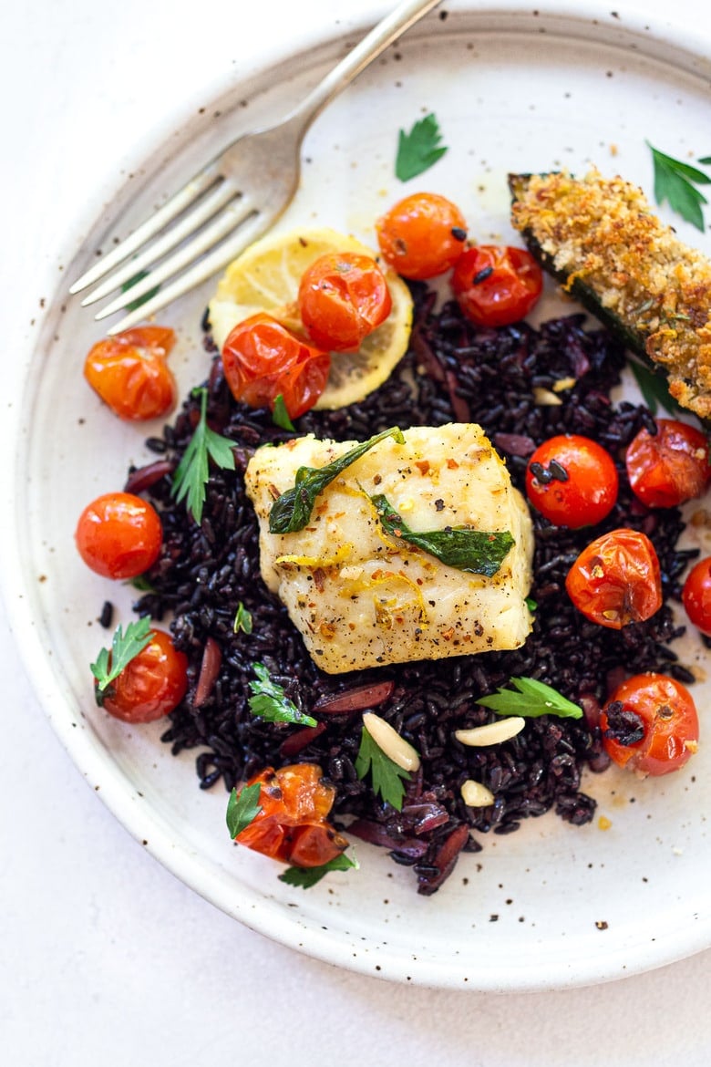 Simple Baked Cod with Tomatoes, Basil, Garlic and Lemon- a fast and easy weeknight dinner that is healthy and delicious! #bakedcod #bakedfish #weeknightdinner #weeknightdinners #easyfishrecipes 