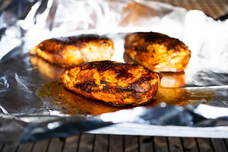 Chili Lime Chicken with Glazed Peaches - a fast and easy weeknight dinner highlighting fresh juicy peaches. Can be made with breast or thigh meat. #chicken #chickenrecipes #peaches #easydinner #chililimechicken #weeknightdinner #easydinner #bakedchicken 