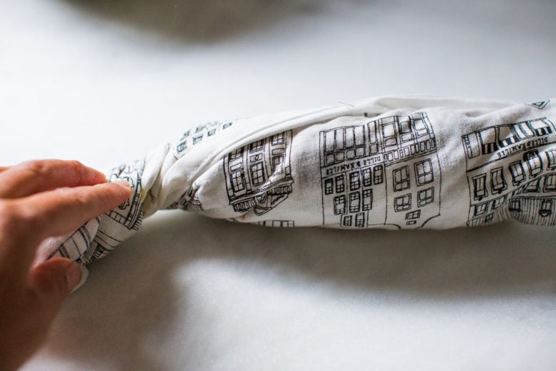 Crispy Jackfruit Carnitas - a wrapped dishtowel with jackfruit inside.