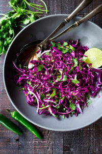 Mexican Slaw with jalapeño and lime- perfect for fish tacos or a vegan side to your Mexican Feast. Fast and easy and Vegan! #tacoslaw #mexicanslaw #cabbageslaw #slaw #veganslaw