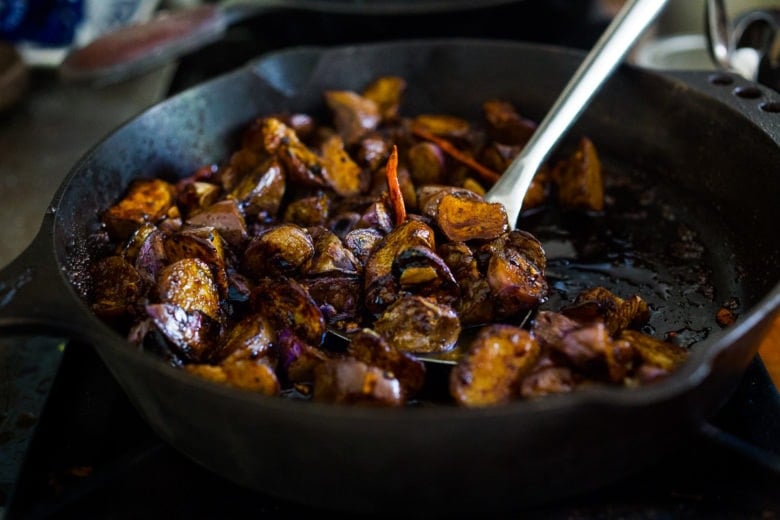 Stir-fried Chinese eggplant recipe with Szechuan sauce, chilies and peanuts.