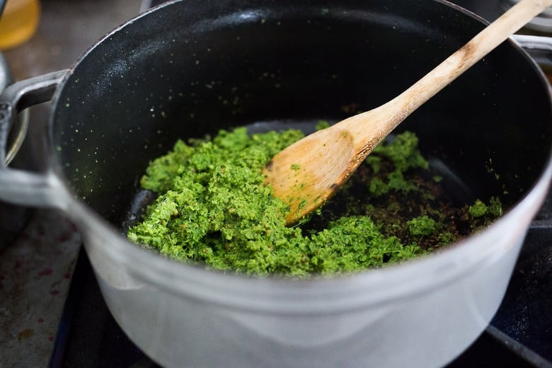 stir frying the green curry paste