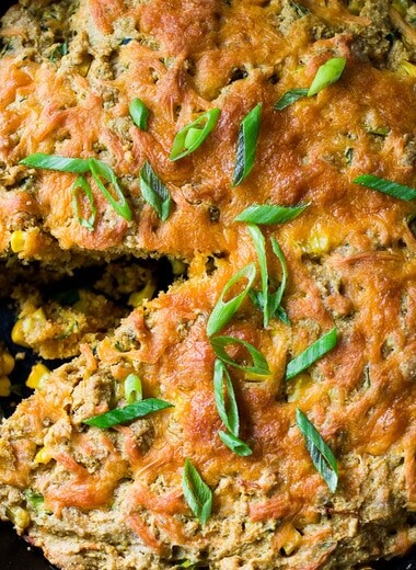 Zucchini Cornbread! A savory zucchini bread infused with Mexican spices, cornmeal, fresh corn and sharp cheddar cheese, baked in a skillet. A cozy side to stew, soup and chili. 