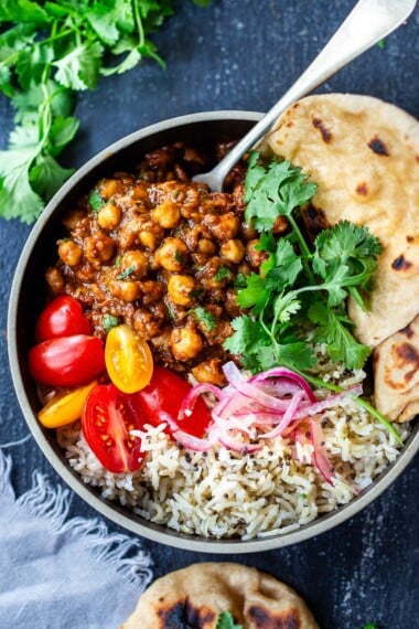 This authentic Chana Masala Recipe can be made in an Instant pot or on the stove top. A quick and easy Vegetarian dinner recipe that is full of amazing Indian flavor!