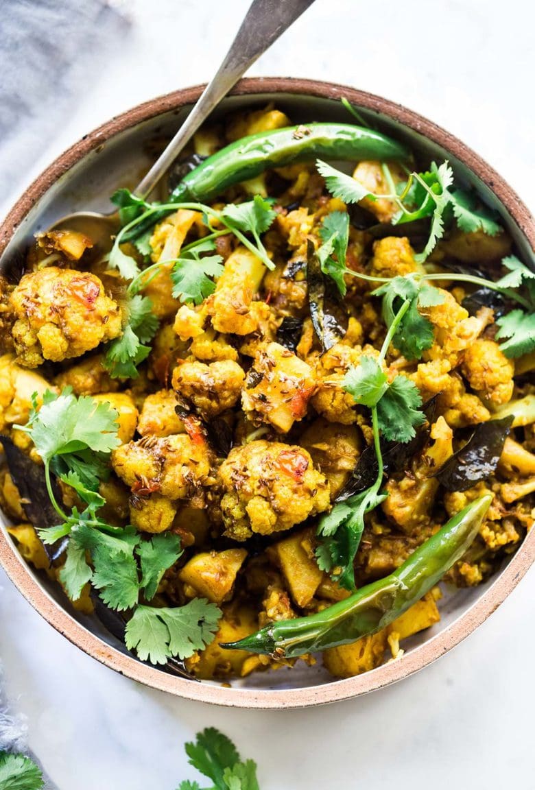 Flavorful Aloo Gobi! Indian-Spiced Potatoes and Cauliflower with Masala Spices- an easy authentic healthy Indian classic that can be made on the stovetop! Vegan adaptable. #aloo #aloogobi #aloogobimasala #indianfood #potatorecipes #cauliflowerrecipes #vegetarian