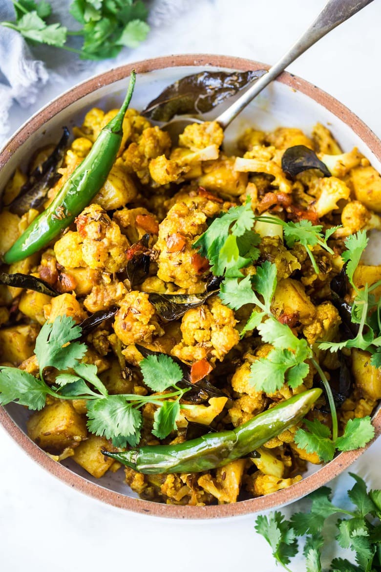 Flavorful Aloo Gobi! Indian-Spiced Potatoes and Cauliflower with Masala Spices- an easy authentic healthy Indian classic that can be made on the stovetop! Vegan adaptable. #aloo #aloogobi #aloogobimasala #indianfood #potatorecipes #cauliflowerrecipes #vegetarian 