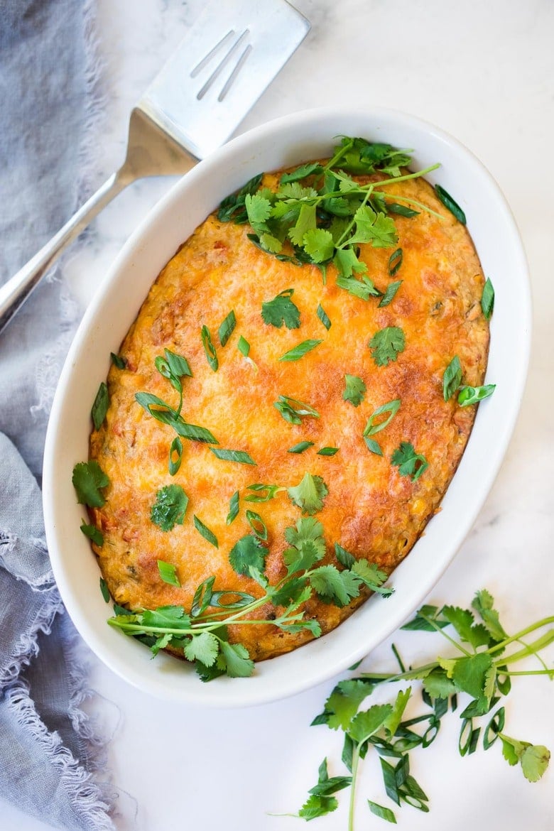 Cornbread Casserole! Seasoned with Mexican spices and filled with healthy veggies and cheddar cheese, this easy corn casserole can be put together in just 20 minutes before baking in the oven. #weeknightdinner #weeknightmeal #vegetariandinner #vegetarian #cornbread #corncasserole #cornbreadcasserole 