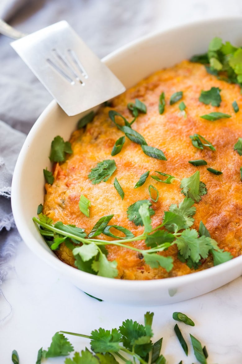 Cornbread Casserole! Seasoned with Mexican spices and filled with healthy veggies and cheddar cheese, this easy corn casserole can be put together in just 20 minutes before baking in the oven. #weeknightdinner #weeknightmeal #vegetariandinner #vegetarian #cornbread #corncasserole #cornbreadcasserole