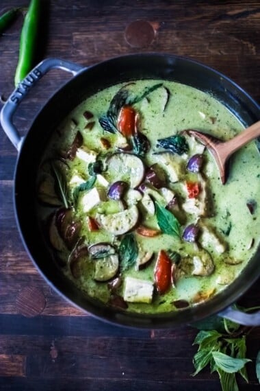 An easy authentic recipe for Thai Green Curry with eggplant and your choice of tofu, chicken or shrimp.  A fast and easy weeknight dinner that can be made in 30 minutes!  Use store-bought green curry paste or make your own homemade green curry paste.