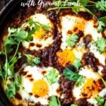 Moroccan Eggs! Eggs are baked in a flavorful lamb stew infused with Moroccan Spices, topped with Harissa Yogurt. A delicious breakfast or brunch recipe. #moroccanrecipes #bakedeggs #lambrecipes #groundlamb #brunch #breakfastrecipes