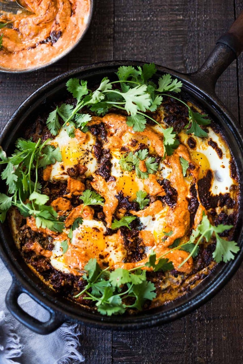Eggs baked in a moroccan lamb stew- moroccan Eggs with Harissa yogurt