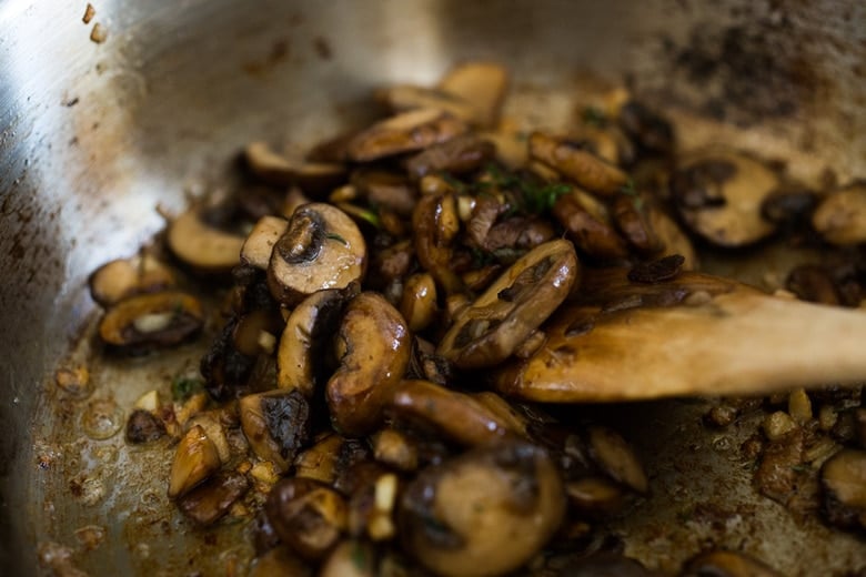 onions, mushrooms and garlic in a pan
