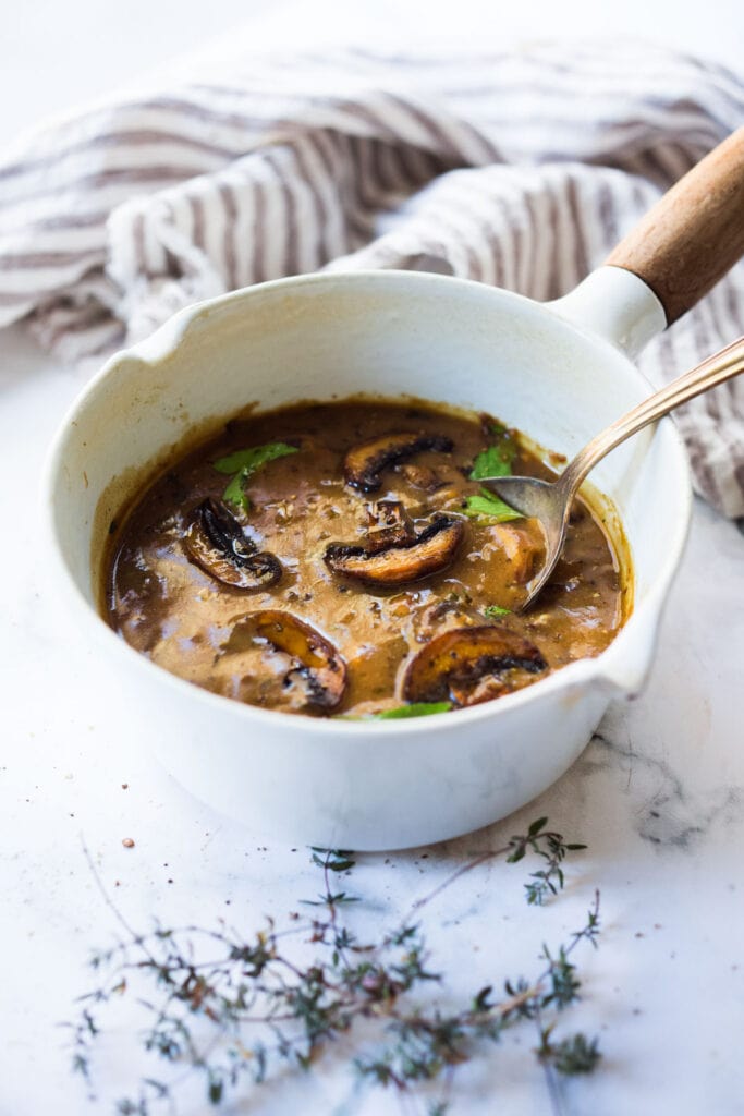 An easy recipe for Mushroom Gravy that is vegetarian (vegan-adaptable) healthy and full of flavor. #mushroomgravy #vegangravy #gravy