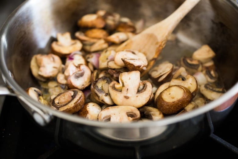 Saute the onions and mushrooms over medium high heat